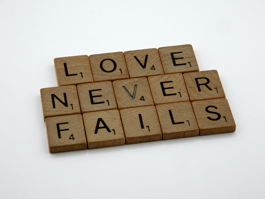 Blocks that spell "Love Never Fails". Blog. The priceless resources of time and compassion.